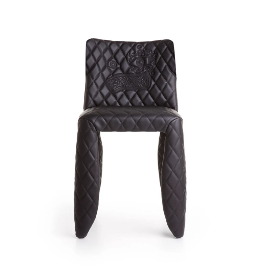 devil chair with monster embroidery and padded legs